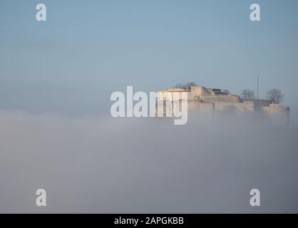 23 January 2020, Baden-Wuerttemberg, Neuffen: The ruins of Hohenneuffen Castle can be seen above fog. Photo: Marijan Murat/dpa Stock Photo