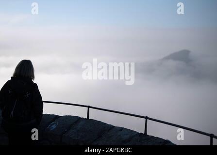 23 January 2020, Baden-Wuerttemberg, Neuffen: A woman looks at the view of the edge of the Swabian Alb. Photo: Marijan Murat/dpa Stock Photo