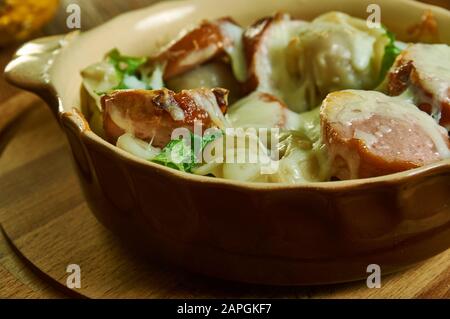 Italian Sausage and Ravioli Casserole, ravioli is layered in a dish with marinara sauce, Italian sausage, and cheese and baked Stock Photo