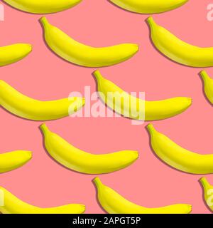 Seamless pattern of yellow bananas on a pink background. Banana print. Yellow south fruit. Stock Photo