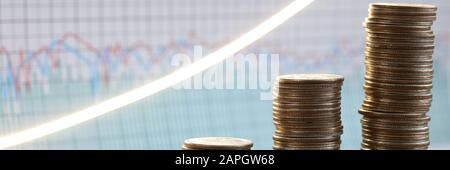 Stack of silver coins presentation at table going up Stock Photo