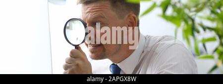 Man sitting at workplace Stock Photo