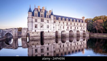Castle or chateau de Chenonceau at sunset, France. This Renaissance castle is one of the main landmarks in France. Panoramic view of the old castle on Stock Photo