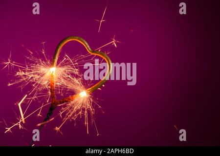Sparkler in shape of heart. Wedding love Valentine's day banner template with place for text. Stock Photo