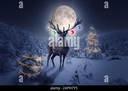 Little Santa stands next to an Armenian wooden Christmas tree toy. There is  a small toy deer near the tree. in miniature. Christmas decorations Stock  Photo - Alamy