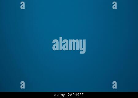 dark blue color on a solid stone wall as background texture. beautiful modern retro color Stock Photo