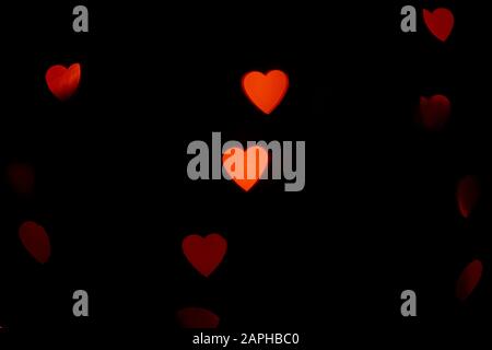 Valentines background. Abstract heart bokeh background. Defocused blurred heart shaped lights. Valentines Day background Stock Photo