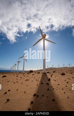 wind turbine in the desert with blue sky  background. wind mill farm in california desert Stock Photo