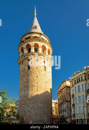 Galata Tower in summer, Istanbul, Turkey. Ancient tower in the Galata district of Istanbul. Beautiful view of the famous Istanbul landmark. Old archit Stock Photo