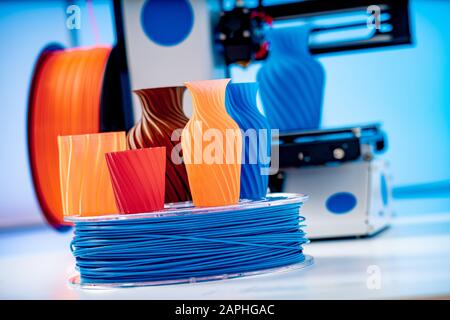 3D Printer Plastic filament for 3D printer and printed products in the interior of the design office Stock Photo