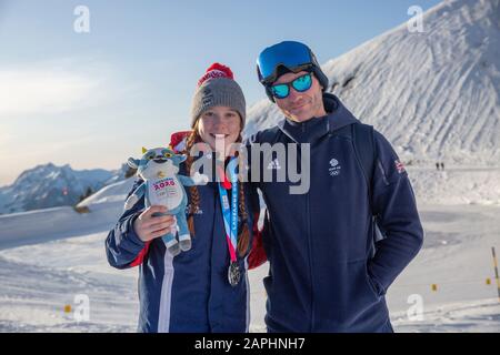Team GB’s Kirsty Muir (15) following winning silver at Women’s Freeski Big Air with coach Joe Tyler during the Lausanne 2020 Youth Olympic Games. Stock Photo