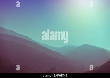 Silhouette of mountains in the early misty morning.  View of the mountains in autumn. Beautiful nature landscape. Carpathian mountains. Ukraine Stock Photo