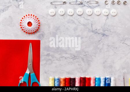 colorful sewing and tailoring tools and items on light background Stock ...