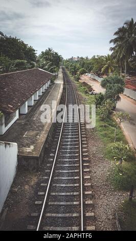 Bentota train station on a rainy day, color toning applied, Sri Lanka. Stock Photo