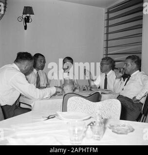 Netherlands Antilles and Suriname at the time of the royal visit of Queen Juliana and Prince Bernhard in 1955 Description: The press at the meal Date: October 1955 Location: Dutch Antilles Keywords: food, journalists Stock Photo