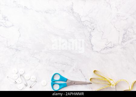 colorful sewing and tailoring tools and items on light background Stock Photo