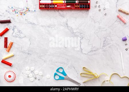 colorful sewing and tailoring tools and items on light background Stock Photo