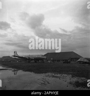 War Volunteers in Malacca and Indonesia Description: The Skymaster 313 at the ground Date: 1946 Keywords: aircraft, airports Stock Photo