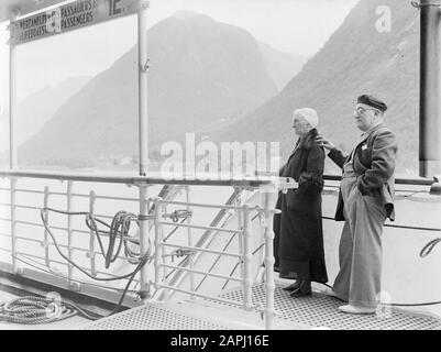 Sea voyage with MS Johan van Oldenbarnevelt to Norway Description: The playwright Esther de Boer-van Rijk with her son-in-law Henri (Hartog) de Vries on board in the Fjaerland-fjord Date: 1933 Location: Fjaerland, Norway Keywords: actors, cruises, cruise ships, families, fences, headgear, fun, ships, tourism Personal name: Boer-van Rijk, Esther de Stock Photo