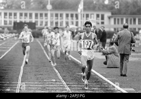 International Athletics competitions at Nenijtobaan, Rotterdam; 5.000 meters men: (r.) winner (nr. 197) N. Gamoudi (Tunisia) in action Description: The Tunisian N. Gamoudi (nr. 197) wins the 5.000 meter men Date: 4 July 1970 Location: Rotterdam, Zuid-Holland Keywords: athletes, athletics, running, victories, athletes Personal name: Gamoudi, N. Institution name: Nenijtobaan Stock Photo