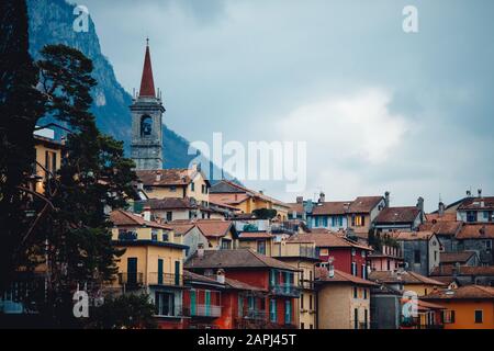Evening view city Bellagio and Varenna Como water lake Italy blue sky mountain Stock Photo