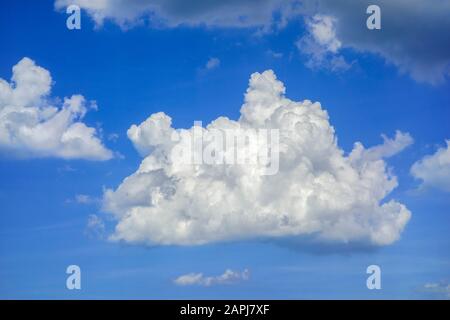 Blue sky with white cumulus mediocris cloud which belongs to the low-level clouds Stock Photo