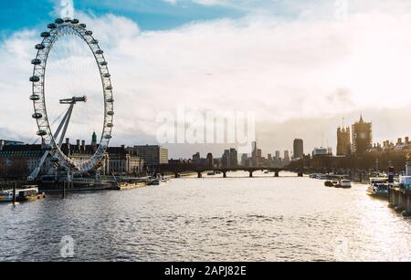 London cityscape at sunrise with famous landmarks: London Eye, County Hall, Westminster Bridge, Houses of Parliament, Big Ben and river Thames Stock Photo