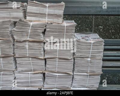 Stacked piles of DMG's Metro newspaper [UK's highest-circulation print newspaper] awaiting distribution near London's Bond Street Underground station. Stock Photo