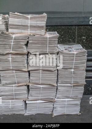 Stacked piles of DMG's Metro newspaper [UK's highest-circulation print newspaper] awaiting distribution near London's Bond Street Underground station. Stock Photo