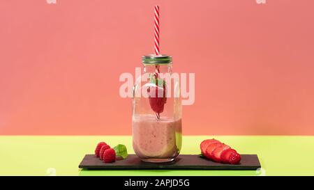 Delicious looking strawberry milkshake in a glass bottle Stock Photo