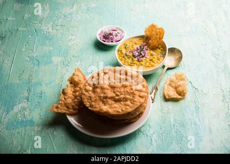 Dal pakwan is an authentic Sindhi breakfast. It is a combination of deepfried, crisp and unpuffed Maida puris served with Daal made using chana or spl Stock Photo