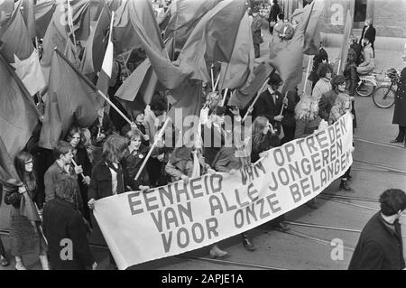 Demonstrative parade in Amsterdam by the Communist Party Description: Protesters with banners and flags draw through the streets of Amsterdam Date: March 27, 1971 Location: Amsterdam, Noord-Holland Keywords : demonstrations, banners, flags Settings Name: CPN Stock Photo