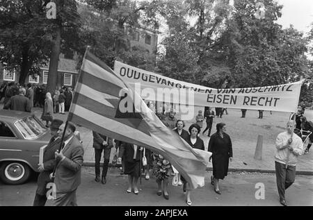 Demonstration of the Auschwitz Committee in Amsterdam with the aim of placing Willy Lages of war criminal within the reach of Nedelandse Justice Description: Protesters on their way to the Waterlooplein in Amsterdam Date: 18 September 1966 Location: Amsterdam, Noord-Holland Keywords: demonstrations, banners Personal name: Lages, Willy Stock Photo