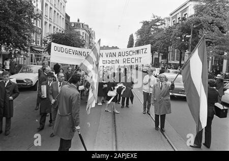 Demonstration of the Auschwitz Committee in Amsterdam with the aim of placing Willy Lages of war criminal within the reach of Nedelandse Justice Description: Protesters on their way to the Waterlooplein in Amsterdam Annotation: marginal negative strip 5 and 6: flowers near the monument of the Hollandsche Schouwburg marginal negative strip 4: flowers near the monument Population Register Date: 18 september 1966 Location: Amsterdam, Noord-Holland Keywords: demonstrations, banners Personal name: Lages, Willy Stock Photo