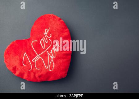 Valentine's day presents. Red heart shaped pillow with I love you writing Stock Photo