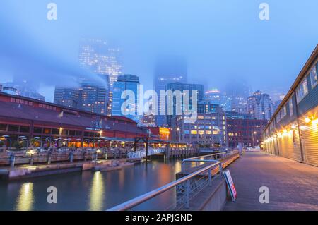 View of downtown Seattle on a foggy winter morning from Pier 56, Washington, United States. Stock Photo