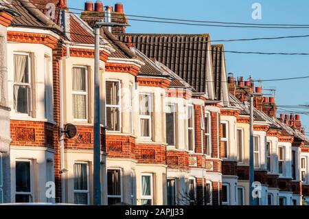 Evening sun lighting up the fronts of terraced Edwardian houses in Hunstanton, Norfolk. Stock Photo