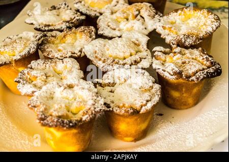 Mince pies dusted with caster sugar and baked in miniature individual tins Stock Photo