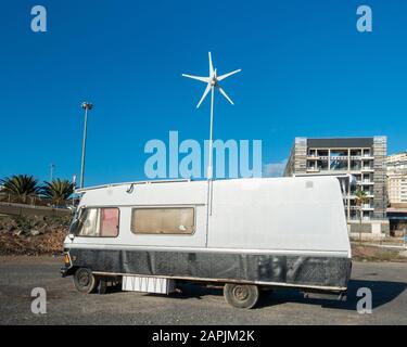 Old Mercedes camper van overlooking beach in Spain Stock Photo