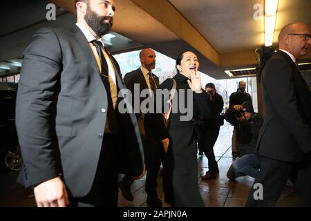 Vancouver, Canada. 23rd Jan, 2020. Huawei CFO Meng Wanzhou wearing a GPS tracker ankle bracelet, is escorted by Court appointed Security as she arrives for the fourth day of her week long extradition hearings at BC Supreme Court in Vancouver, British Columbia (BC), Thursday, January 23, 2020. Arrested Dec 1, 2018 and released soon after on $7.5 million bail Meng is fighting extradition to the USA on fraud charges. Photo by Heinz Ruckemann/UPI Credit: UPI/Alamy Live News Stock Photo