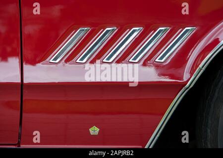 Close up detail of the side of a 60's vintage red Chrysler 300 Stock Photo