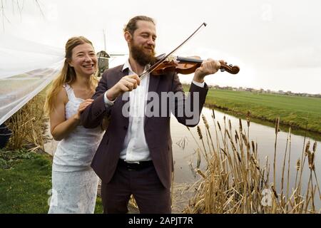 Loving couple bride and groom in wedding clothes Stock Photo