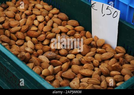 Almonds in shells for sale with price in euro Stock Photo