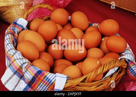 Fresh brown eggs in a wicker basket Stock Photo