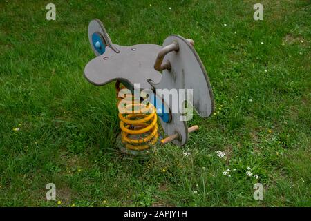 a spring rocker for kids on a meadow Stock Photo