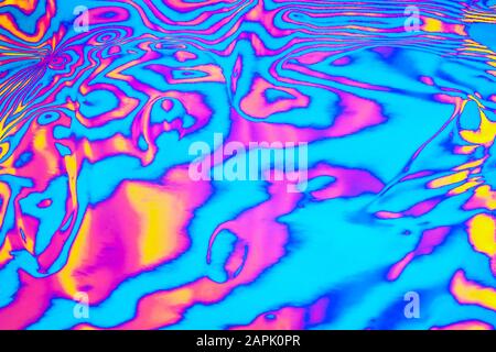 Abstract trendy neon colored psychedelic fluorescent striped zebra textured neon background Stock Photo