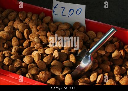 Almonds in shells for sale with price in euro Stock Photo
