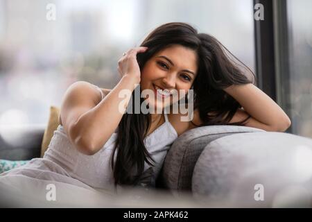 Adorable, cute, warm, friendly, sincere and likable south asian Indian young woman lifestyle home living Stock Photo