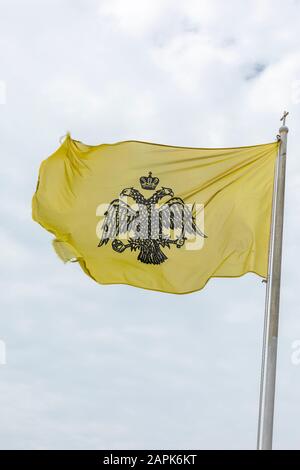 yellow flag with two headed eagle