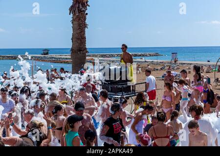 A young couple dancing at a foam party, beach party, Nissi Beach, Agia